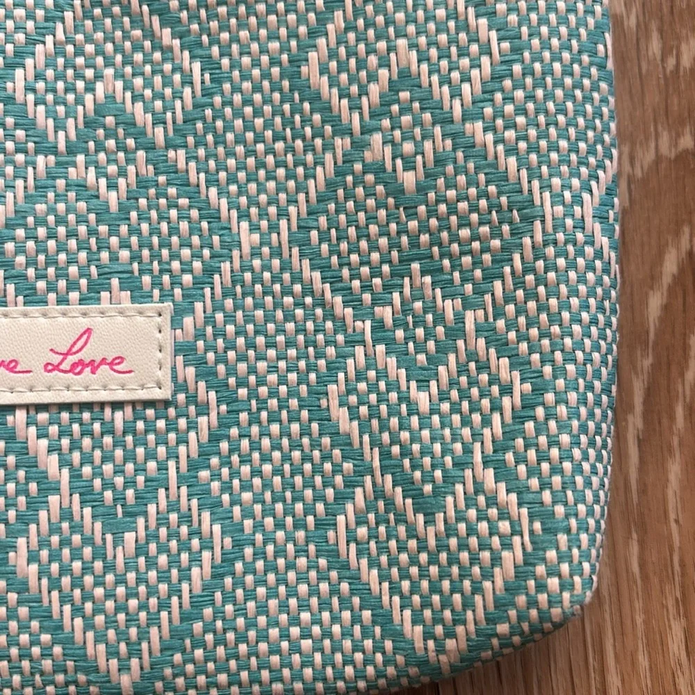 Josie Maran white/turquoise patterned woven cosmetic/makeup bag